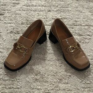 Tan patent leather loafers with block heal and gold buckle